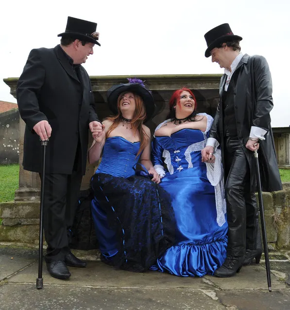 Left to right. Gary Mills, Deanne Dudley, Robyn Dudley and Mark Pickering in the grounds of St Mary's Church, Whitby, during the Whitby Gothic festival taking place this weekend, on  April 27, 2014. The twice yearly event attracts Goths from across the UK and beyond to the historic fishing town and is a great boost to the local economy. (Photo by Anna Gowthorpe/PA Wire)