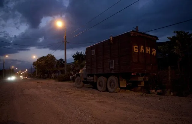 A truck, which serves as a mobile bath house (or traditional regional banya) is parked along a street in Tskhinvali, the capital of the breakaway region of South Ossetia, Georgia, July 4, 2015. (Photo by Kazbek Basaev/Reuters)