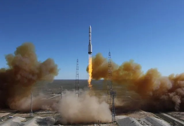 A Russian-built Proton rocket with Russian relay satellite Luch-5V and the Kazakh communication satellite KazSat-3 aboard blasts of from a launch pad in the Russian leased Kazakhstan's Baikonur cosmodrome on April 28, 2014. (Photo by AFP Photo/Stringer)