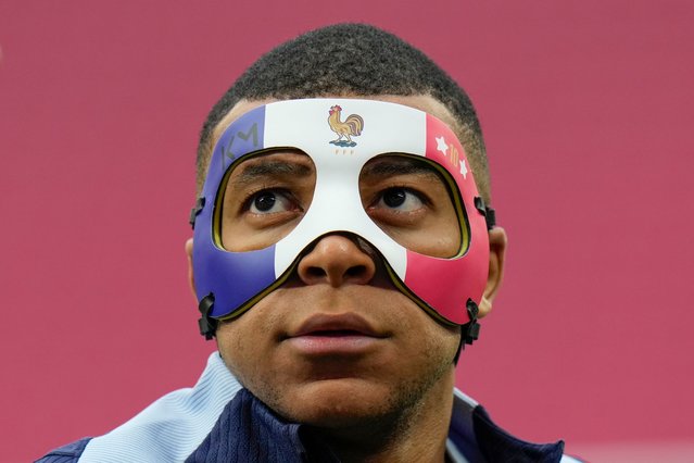 France's Kylian Mbappe gestures as he wears a face mask during a training session in Leipzig, Germany, Thursday, June 20, 2024. France will play against Netherland during their Group D soccer match at the Euro 2024 soccer tournament on June 21. (Photo by Hassan Ammar/AP Photo)