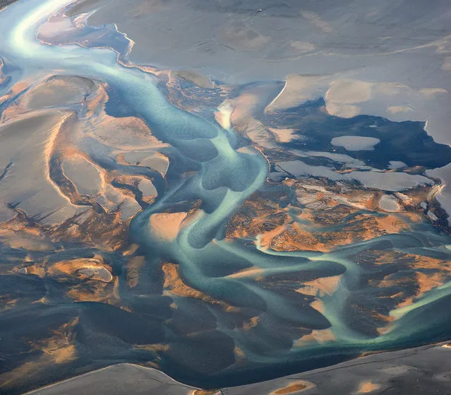 These pictures look like an artist has painted abstract patterns on canvas – but in fact they are natural rivers captured on camera. The spectacular rivers in Iceland's central highlands and southern parts originate from glaciers, which is why the water is a milky colour. (Photo by Andrey Ermolaev/Solent News)