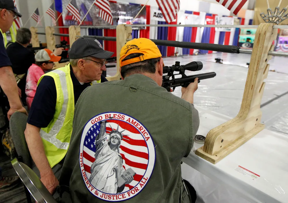 Gun Fans Admire Weapons at NRA Meeting