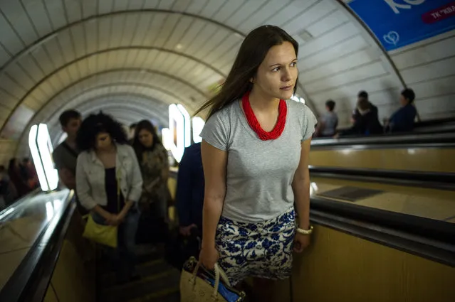 Daria Mykhailova, a student, is seen in the Kyiv subway on her way from home to the university, on May 23, 2014, in Kiev, Ukraine. (Photo by Alexey Furman/The Washington Post)