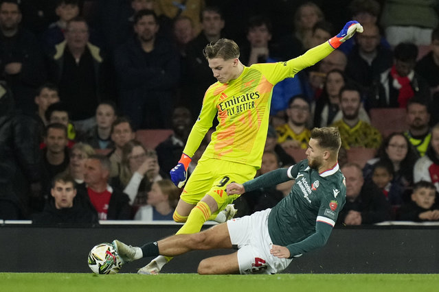 Arsenal's 16-year-old goalkeeper Jack Porter, left, is challenged by Bolton's John McAtee during the English League Cup third round soccer match between Arsenal and Bolton Wanderers at the Emirates stadium in London, Wednesday, September 25, 2024. (Photo by Kirsty Wigglesworth/AP Photo)