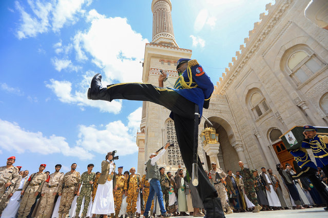 Yemeni honour guards carry coffins of casualties of recent strikes by US and British forces, during a funeral ceremony at Al-Saleh mosque in the Huthi-run capital Sanaa, on June 3, 2024. Yemen's Huthis launched several drones and two ballistic missiles a day earlier, the US military said on June 1, after deadly overnight strikes by American and British forces prompted retaliatory threats from the rebels. (Photo by Mohammed Huwais/AFP Photo)