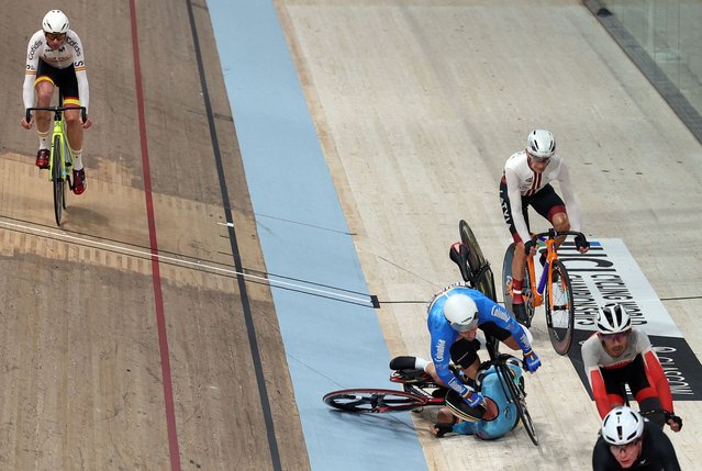 Columbia's Guido Cardona Maya and Belgium's Louis Clincke collide during the men's C4 para-cycling Scratch Race at the Sir Chris Hoy velodrome during the UCI Cycling World Championships in Glasgow, Scotland on August 6, 2023. (Photo by Adrian Dennis/AFP Photo)