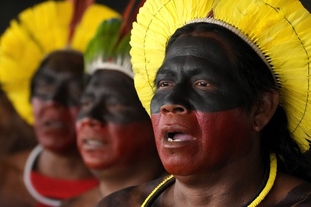 Kayapos sing during a protest against a proposed constitutional amendment that threatens some Indigenous land rights, in Brasilia, Brazil, Wednesday, October 30, 2024. (Photo by Eraldo Peres/AP Photo)