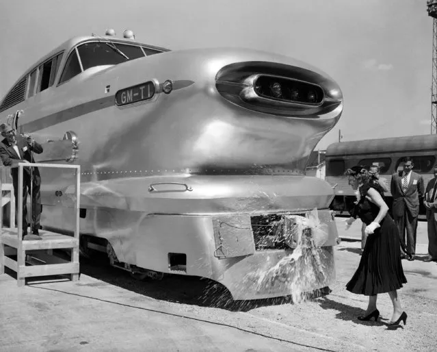 N.C. Dezendorf, wife of the general manager of the Electro-Motive division of General Motors, christens the new lightweight “Aerotrain” at the company's locomotive works in La Grange, Ill. on August 22, 1955. (Photo by Edward Kitch/AP Photo)