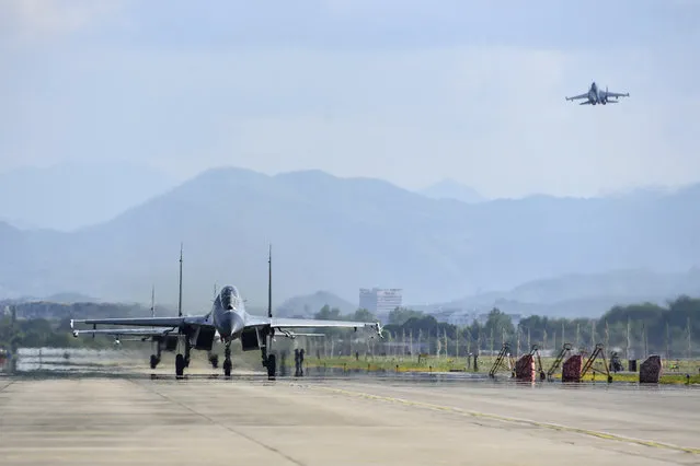 In this photo released by China's Xinhua News Agency, air force and naval aviation corps of the Eastern Theater Command of the Chinese People's Liberation Army (PLA) fly planes at an unspecified location in China, Thursday, August 4, 2022. (Photo by Fu Gan/Xinhua via AP Photo)