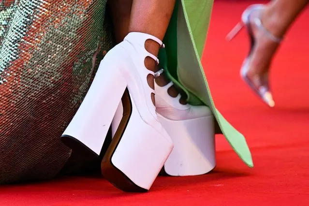 A detail shows the shoes of member of the “Luigi De Laurentiis” award jury, US actress Tessa Thompson as she arrives on September 5, 2022 for the screening of the film “Don't Worry Darling” presented out of competition as part of the 79th Venice International Film Festival at Lido di Venezia in Venice, Italy. (Photo by Tiziana Fabi/AFP Photo)