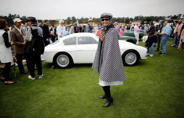 A guest attends the Concours d'Elegance in Pebble Beach, California, U.S. August 21, 2016. (Photo by Michael Fiala/Reuters/Courtesy of The Revs Institute)