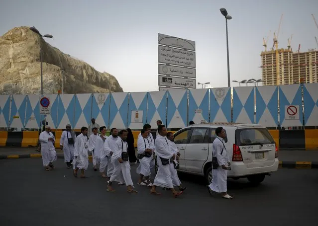 Muslim pilgrims walk towards the Grand mosque in the holy city of Mecca ahead of the annual haj pilgrimage September 21, 2015. (Photo by Ahmad Masood/Reuters)