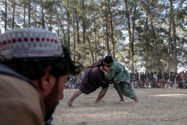 Afghan wrestlers fight at a makeshift wrestling arena in Kabul, Afghanistan, 04 April 2025. Spectators gathered to support their favorite wrestlers from provinces like Herat, Nimroz, Kandahar, Zabul, and Farah during these unofficial competitions, which are often held in celebration of the spring holidays and Nowruz. (Photo by Samiullah Popal/EPA/EFE)