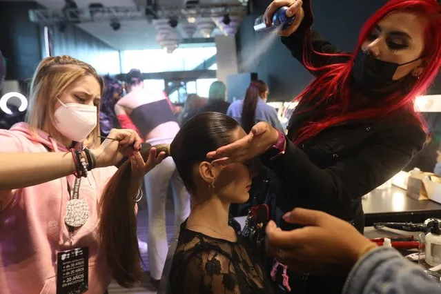 A model prepares to go on the catwalk during the third day of activities of the Mercedes-Benz Fashion Week, in Mexico City, Mexico, 27 April 2022. (Photo by Sashenka Gutierrez/EPA/EFE)