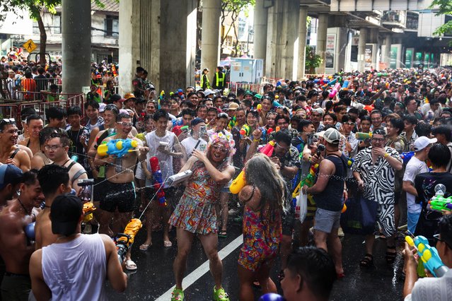 Revellers play with water as they celebrate the Songkran holiday, which marks the Thai New Year, in Bangkok, Thailand, on April 13, 2025. (Photo by Chalinee Thirasupa/Reuters)