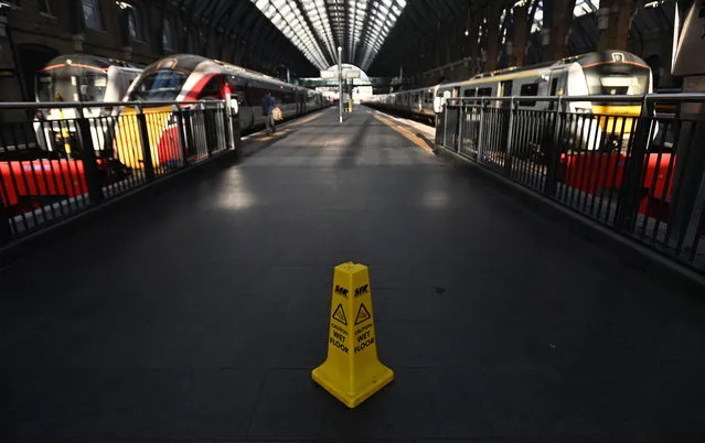 Trains at Kings Cross Station in London, Britain, 17 December 2022. Some forty thousand RMT rail workers have walked out on strike in an on-going dispute over pay and conditions, causing widespread travel chaos across the UK ahead of Christmas. (Photo by Andy Rain/EPA/EFE)