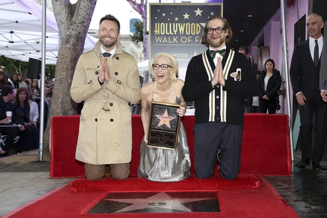 Joel McHale, from left, Gillian Anderson and Bryan Fuller pose for a photo at the Gillian Anderson Star ceremony at the Hollywood Walk of Fame on Monday, January 8, 2018, in Los Angeles. (Photo by Willy Sanjuan/Invision/AP Photo)