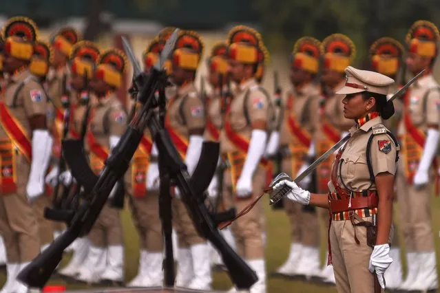 A female officer (R) stands at attention with a group of Indian Railway Protection Force (RPF) personnel during the 74th Republic Day celebrations, in Chennai, India, 26 January 2023. (Photo by Idrees Mohammed/EPA/EFE)