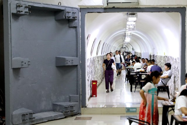 Residents enjoy the cool in an air-raid shelter on a hot summer day on July 15, 2025 in Xi'an, Shaanxi Province of China. As heat wave sweeps multiple regions across China in recent days, many people in big cities have found that air raid shelters are an ideal place to escape from the scorching heat. (Photo by Zhang Yuan/China News Service/VCG via Getty Images)
