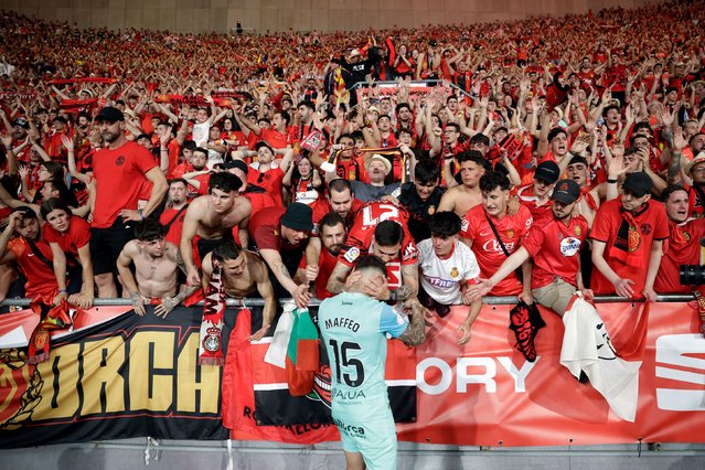 Mallorca fans confort Real Mallorca's Spanish defender #15 Pablo Maffeo at the end of the Spanish Copa del Rey (King's Cup) final football match between Athletic Club Bilbao and RCD Mallorca at La Cartuja stadium in Seville on April 6, 2024. (Photo by Jaime Reina/AFP Photo)