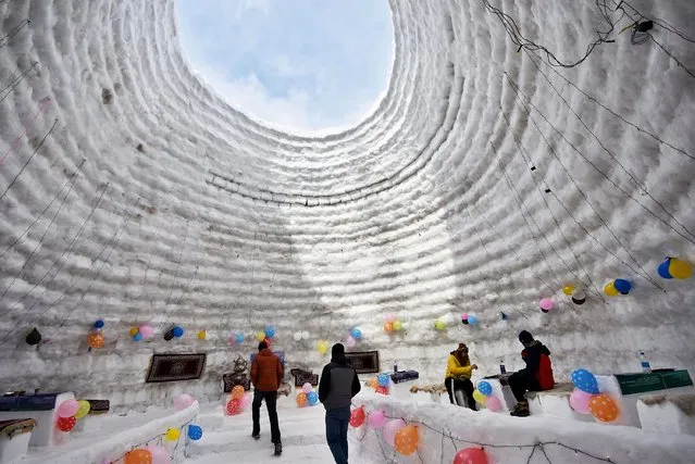 Tourists visit the Igloo cafe in Ski resort Gulmarg, Indian Administered Kashmir on 08 February 2023.An igloo cafe, claimed to be the world's largest, has come up at the famous ski-resort of Gulmarg in Jammu and Kashmir. With a height of 112 Meter (40 feet) and a diameter of 12.8 meter (42 feet), creator of the igloo, claimed it was the world's largest cafe of its kind. It took 20 days to complete it with 25 people working day and night, he said, adding that it took 1,700 man-days to complete the project. (Photo by Mubashir Hassan/Pacific Press/Rex Features/Shutterstock)