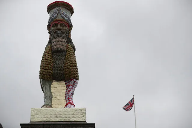 Michael Rakowitz's “The Invisible Enemy Should Not Exist”; a recreation of the Lamassu, a winged deity that stood at the entrance to the Nergal Gate of Niniveh from 700BC until it was destroyed by ISIS in 2015; is seen after it was unveiled on Trafalgar Square's Fourth Plinth, in London on March 28, 2018. (Photo by Hannah McKay/Reuters)