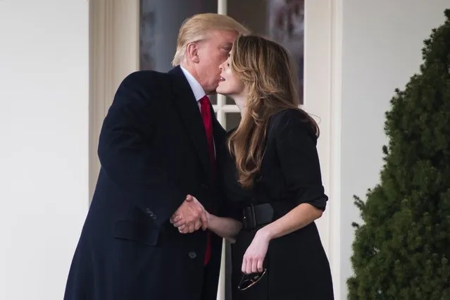 U.S. President Donald Trump greets former White House Communications Director Hope Hicks outside of the Oval Office as he departs the White House for a trip to Cleveland, Ohio, in Washington D.C., U.S., March 29, 2018. (Photo by Jabin Botsford/The Washington Post)