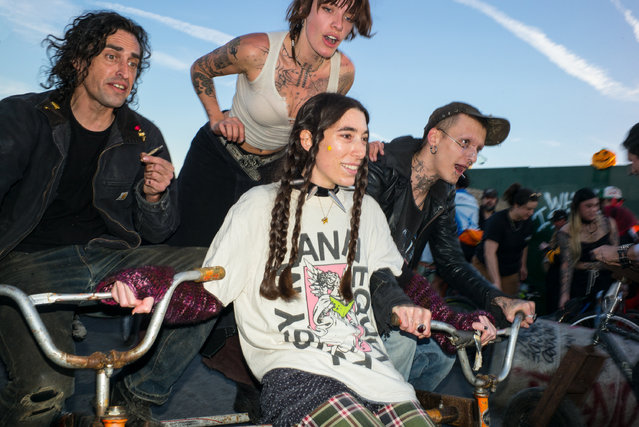 People participate in an annual bike gathering and street party called Bike Kill, 2003 in the Red Hook neighborhood of Brooklyn borough in New York City. (Phonu by Reuben Radding/The Guardian)