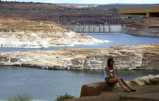 The Glen Canyon dam (background) holds back the Colorado River creating Lake Powell near Page, Arizona, May 26, 2015. (Photo by Rick Wilking/Reuters)