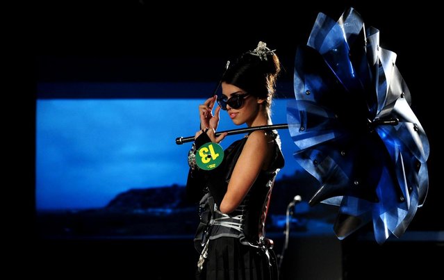 A model presents a creation during Trash Fashion Show in Macedonia's capital Skopje, on Wednesday, June 5, 2013. Teams from 47 high schools from Macedonia participated in the show with creations made of redesigned materials from waste such as  plastic bags, newspapers, cardboard, plastic bottles, cans, used paper, etc. (Photo by Boris Grdanoski/AP Photo)