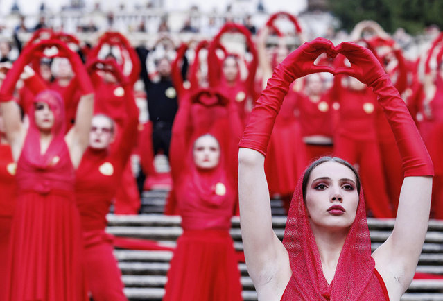 Activists perform on the occasion of the International Day for the Elimination of Violence against Women, in Rome, Tuesday, November 25, 2025 (Photo by Roberto Monaldo/LaPresse via AP Photo)