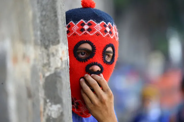 A masked demonstrator clashes with riot police during a protest against Nicaragua's President Daniel Ortega's government in Masaya, Nicaragua June 2, 2018. (Photo by Oswaldo Rivas/Reuters)