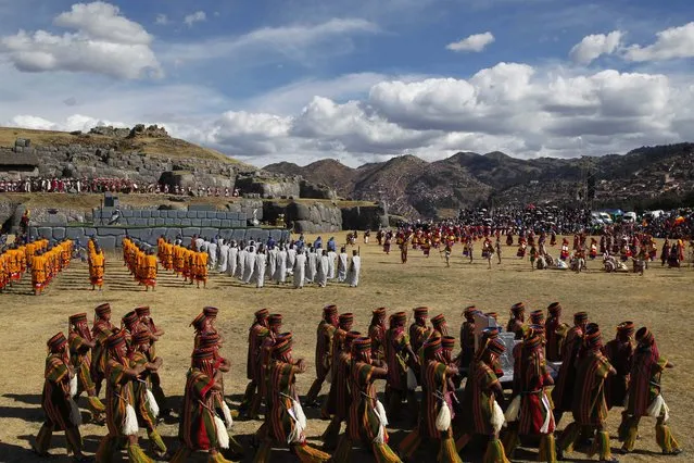 Actors celebrate the Inca ceremony "Inti Raymi" at the Saqsaywaman ruins in Cuzco, Peru, Sunday, June 24, 2018. (Photo by Martin Mejia/AP Photo)
