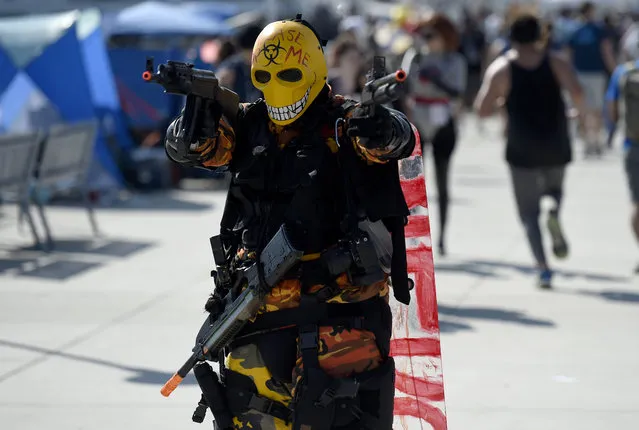 Nicholas Pryor, of San Diego, poses as the character Tyson Rios from the “Army of Two” video game during day one of Comic-Con International on Thursday, July 19, 2018, in San Diego.(Photo by Chris Pizzello/Invision/AP Photo)