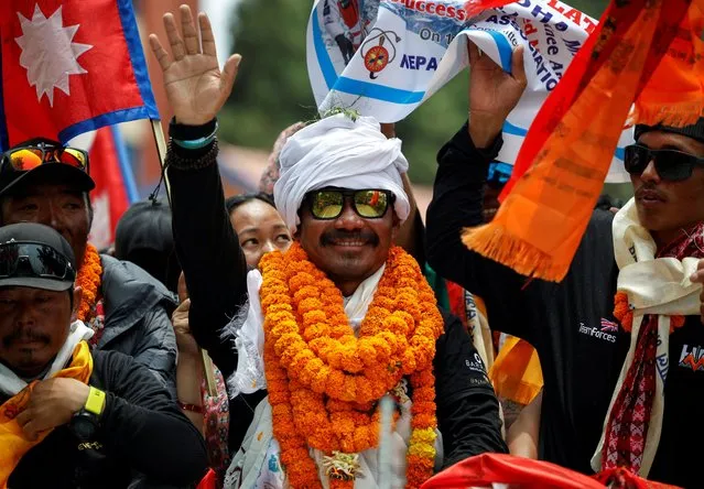 Gurkha veteran, Hari Budha Magar, the first above the knee double amputee to scale Mount Everest waves towards the media upon his arrival in Kathmandu, Nepal, May 23, 2023. (Photo by Navesh Chitrakar/Reuters)
