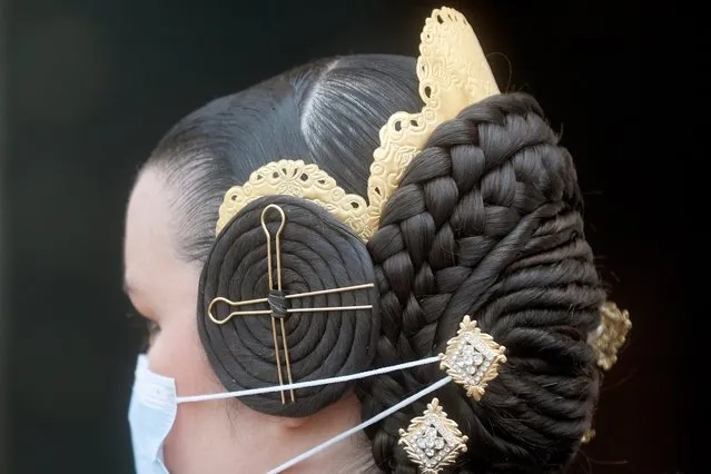 A close-up of the hairstyle of a “fallera”, a female resident wearing the regional costume, on St. Joseph Day despite the Fallas festival was canceled due to the coronavirus pandemic, in Valencia, Spain, 19 March 2021. Traditionally, the fallas sculptures are burnt on St. Joseph Day to put an end to several weeks of one of the most important festivals in Spain. (Photo by Kai Foersterling/EPA/EFE)