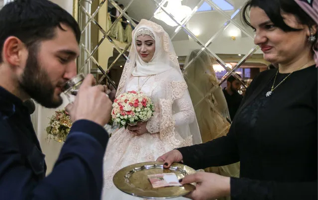 A bride during a traditional Chechen wedding ceremony in Grozny, Chechnya, Russia on November 24, 2016. (Photo by Valery Sharifulin/TASS)