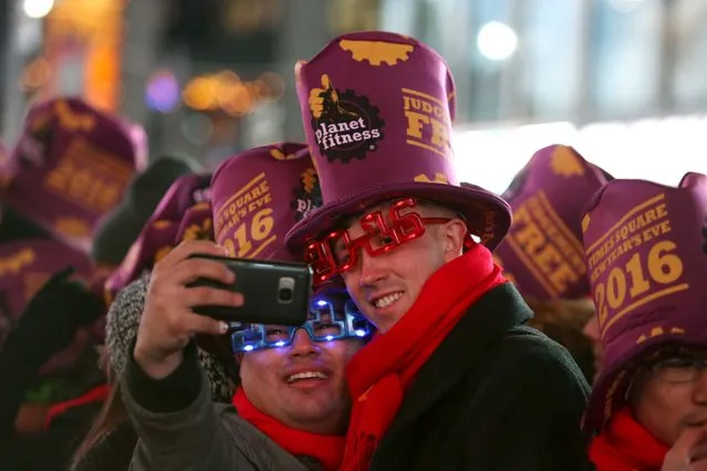 People take a selfie during New Year celebrations in Times Square in the Manhattan borough of New York December 31, 2015. (Photo by Andrew Kelly/Reuters)