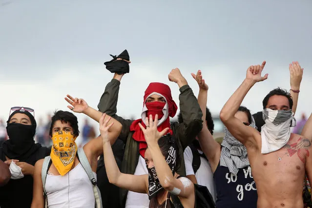 Anti-government demonstrators attend a protest against a constitutional amendment, known as PEC 55, that limits public spending, in front of Brazil's National Congress in Brasilia, Brazil November 29, 2016. (Photo by Adriano Machado/Reuters)