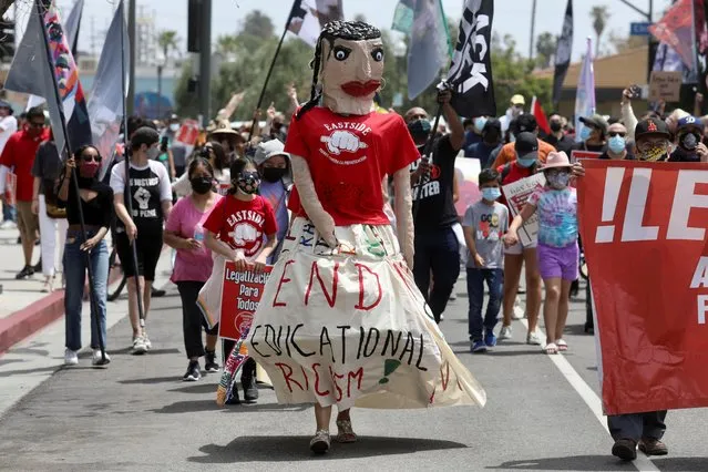 People attend a May Day demonstration in Los Angeles, California, U.S., May 1, 2021. (Photo by David Swanson/Reuters)