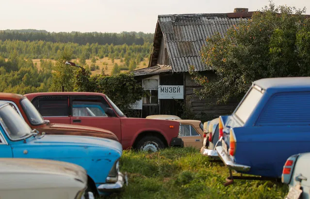 A sign for an open-air museum of Soviet-era vehicles is seen on a house of retired mechanic and retro car collector, Krasinets in the village of Chernousovo, Tula region, Russia on September 27, 2018. (Photo by Maxim Shemetov/Reuters)