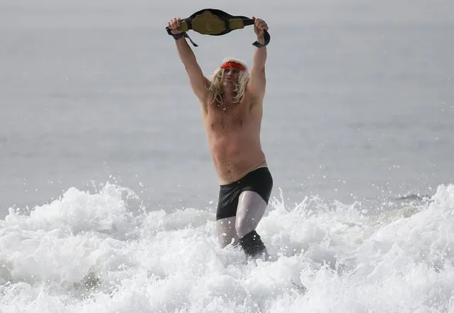 A man dressed as a wrestler competes in the ZJ Boarding House Halloween Surf Contest in Santa Monica, California October 26, 2013. (Photo by Lucy Nicholson/Reuters)