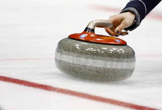 Scotland's skip Eve Muirhead delivers a stone during her curling round robin game against Canada at the World Women's Curling Championships in Sapporo March 15, 2015. (Photo by Thomas Peter/Reuters)
