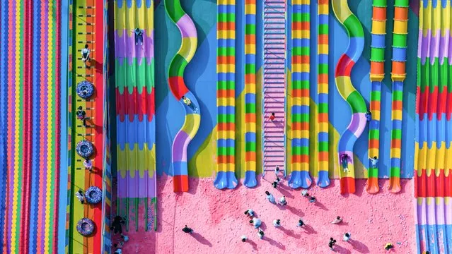 This aerial photo taken on October 29, 2023 shows people playing at a playground in China's southwestern Chongqing municipality. (Photo by AFP Photo/China Stringer Network)