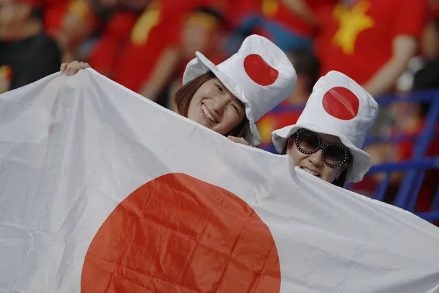 Japan's soccer team supporters smile ahead of the AFC Asian Cup quarterfinal soccer match between Japan and Vietnam at Al Maktoum Stadium in Dubai, United Arab Emirates, Thursday, January 24, 2019. (Photo by Hassan Ammar/AP Photo)