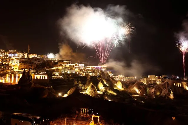 Fireworks illuminate the sky over Cappadocia during new year celebrations in Nevsehir, Turkiye on December 31, 2023. (Photo by Behcet Alkan/Anadolu via Getty Images)
