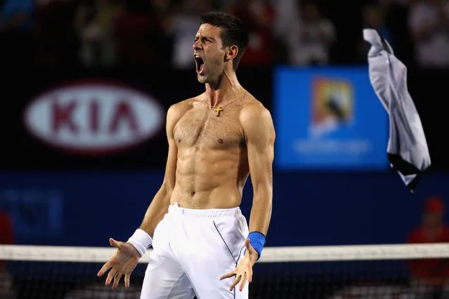 Novak Djokovic of Serbia celebrates after victory in his men's singles final match against Rafael Nadal of Spain on the twelfth day of the Australian Open tennis tournament in Melbourne early January 30, 2012. (Photo by Ryan Pierse/AFP Photo)