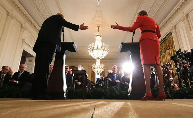 U.S. President Donald Trump and British Prime Minister Theresa May gesture at one another as they hold a joint news conference at the White House in Washington, U.S., January 27, 2017. (Photo by Carlos Barria/Reuters)