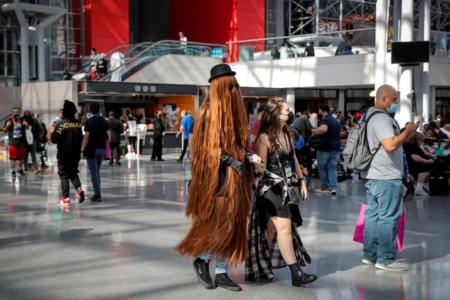 People attend in costume the 2021 New York Comic Con, at the Jacob Javits Convention Center in Manhattan in New York City, New York, U.S., October 7, 2021. (Photo by Brendan McDermid/Reuters)