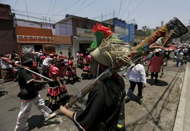 Mexicans wearing period costumes taken part during a re-enactment of the battle of Puebla, along a street in Mexico City May 5, 2015. (Photo by Henry Romero/Reuters)
